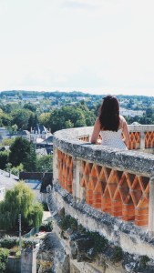 Jenna standing on a parapet overlooking the quaint town of Amboise, France